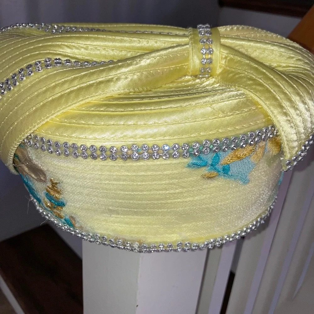 Dorinda Clark Cole women’s Yellow Rhinestone Embellished Satin Pillbox Hat